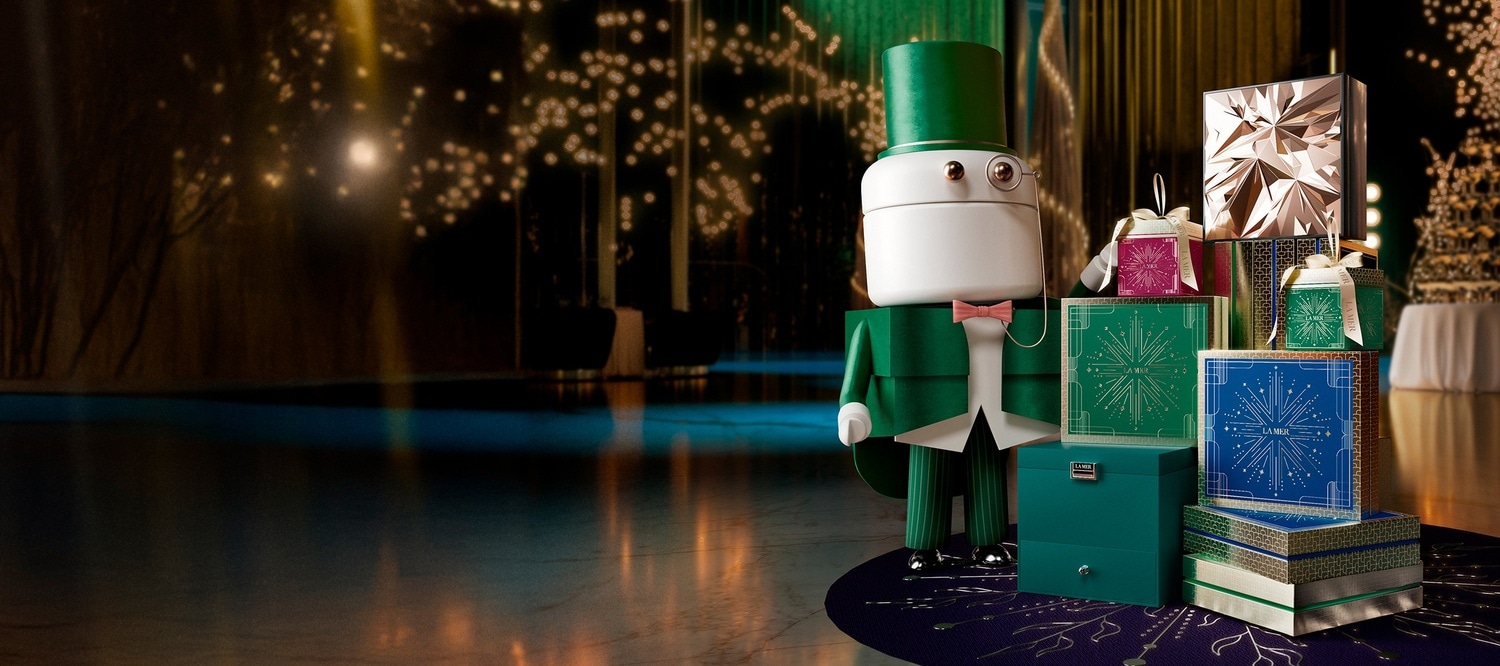 Selection of bestselling La Mer products placed on a festive, grand staircase, decorated in miniature masquerades and headwear